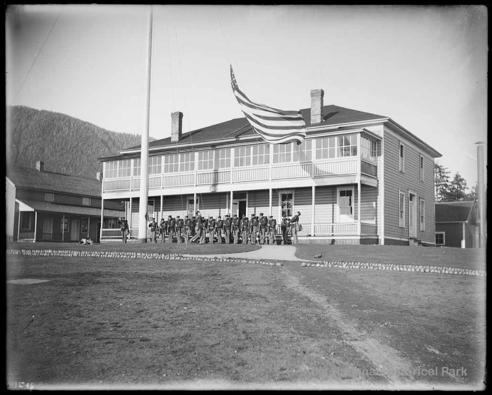 Marines at attention for the raising of the American flag.