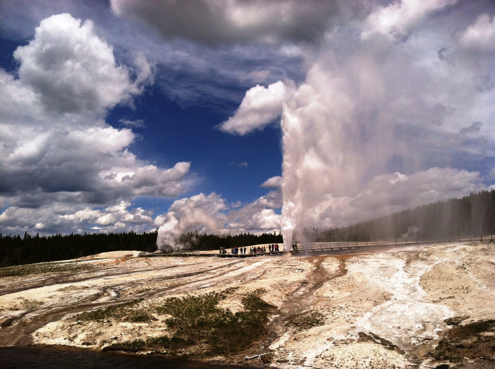 Beehive and Lion geysers go off in the distance.