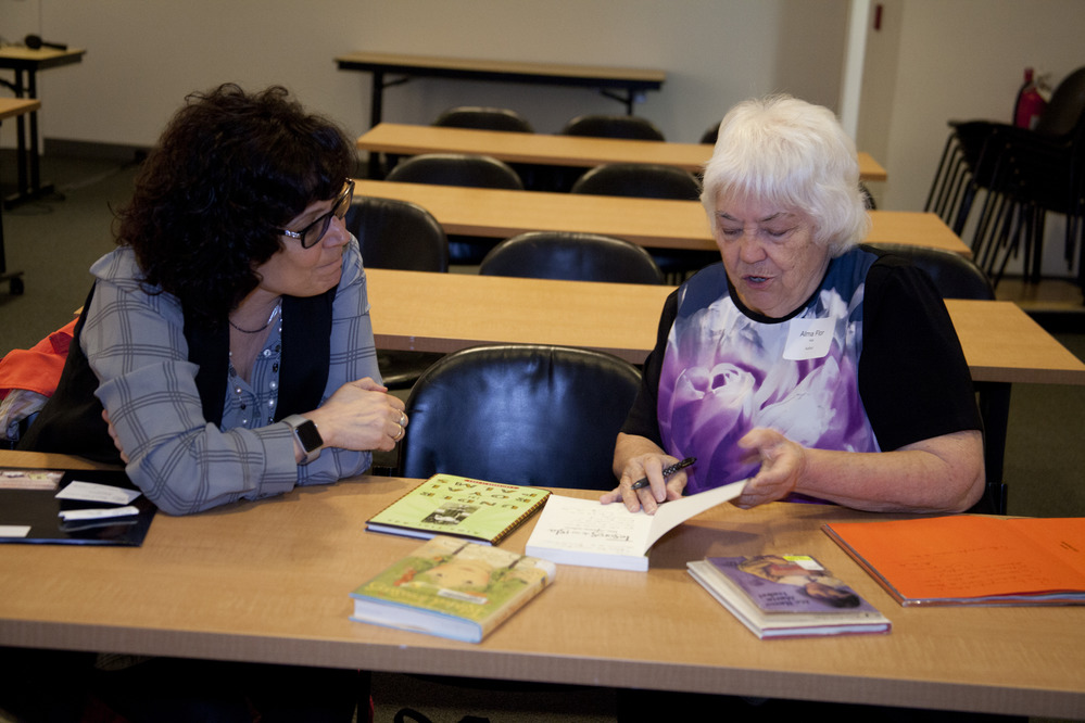 Alma Flor Ada signs book