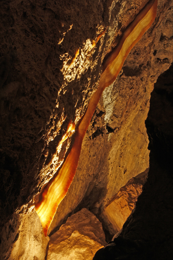 A calcite cave formation resembling a strip of bacon