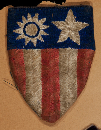  Embroidered badge with red and white stripes and blue bar with sun and star