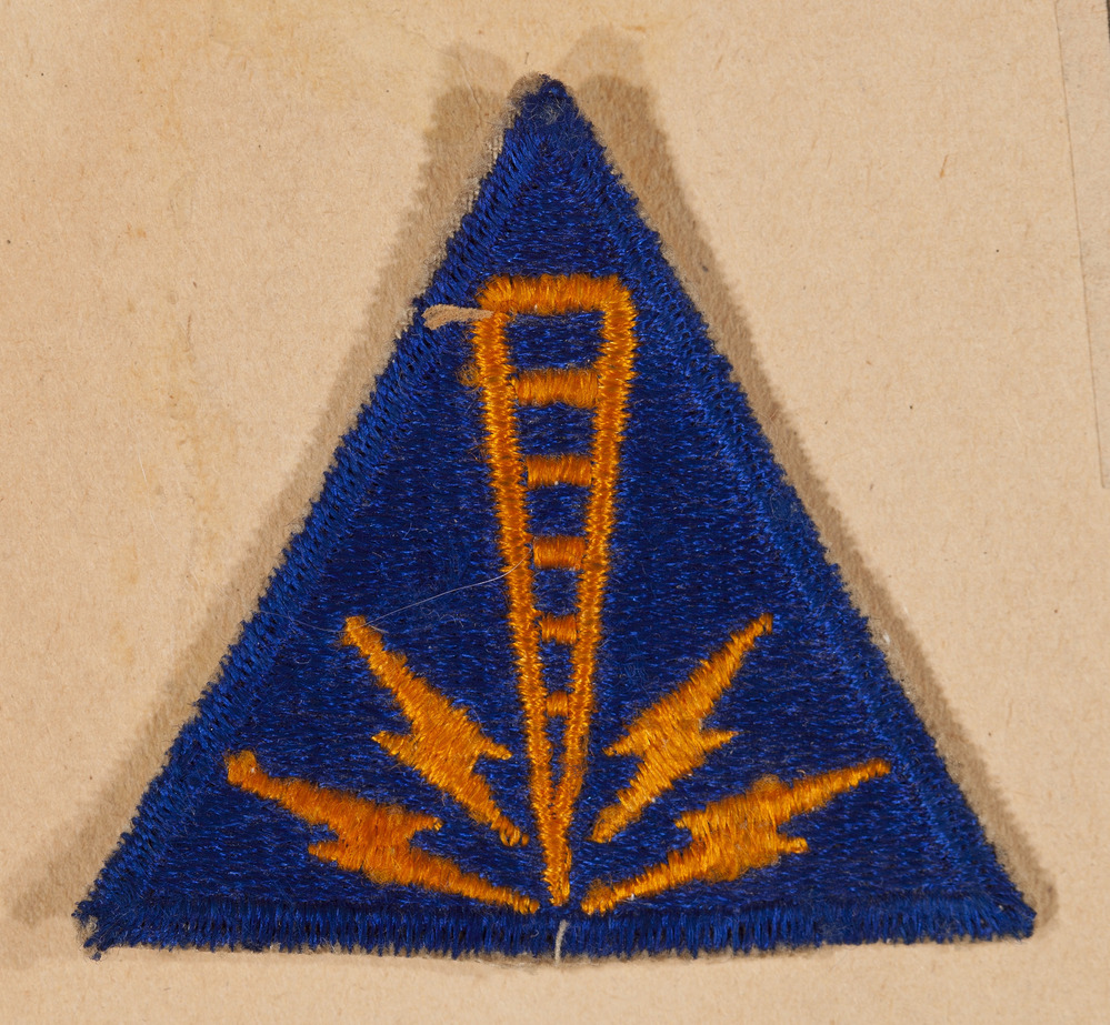 Triangle patch with yellow lightning design