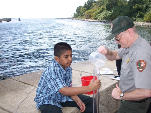 A student at I.S. 27 on Staten Island tests the turbidity of Hudson River water as part of the program "Snapshot on the Hudson."