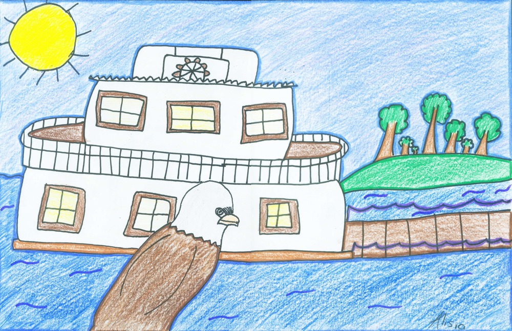 An eagle watches the paddleboat as it makes its way up the river.