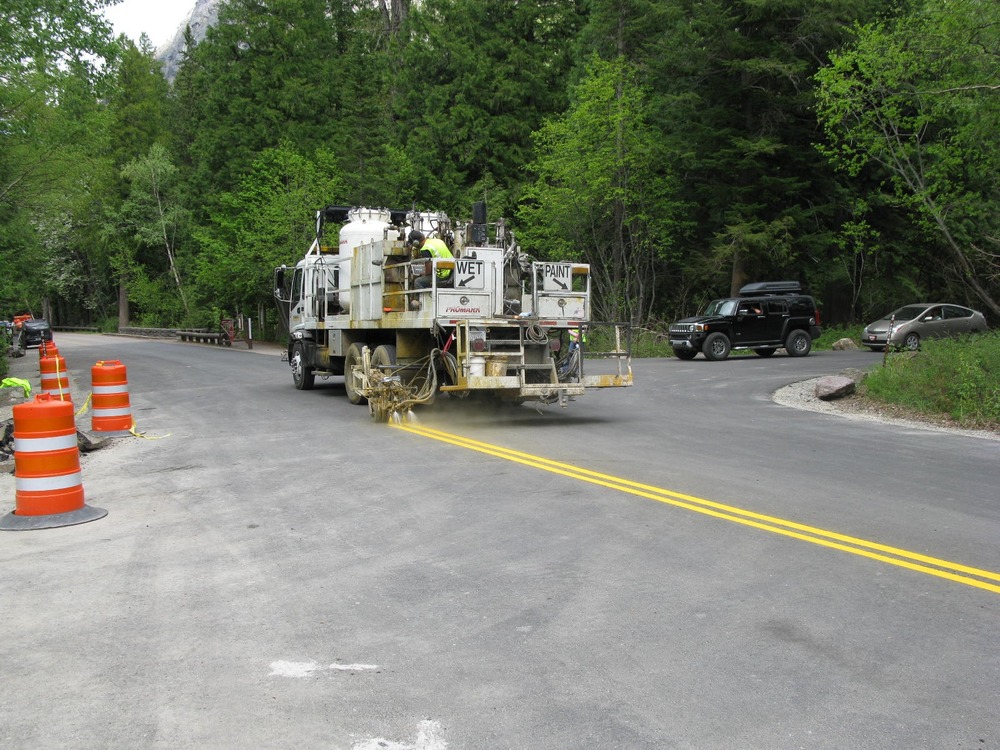 Striping new pavement at Avalanche Creek