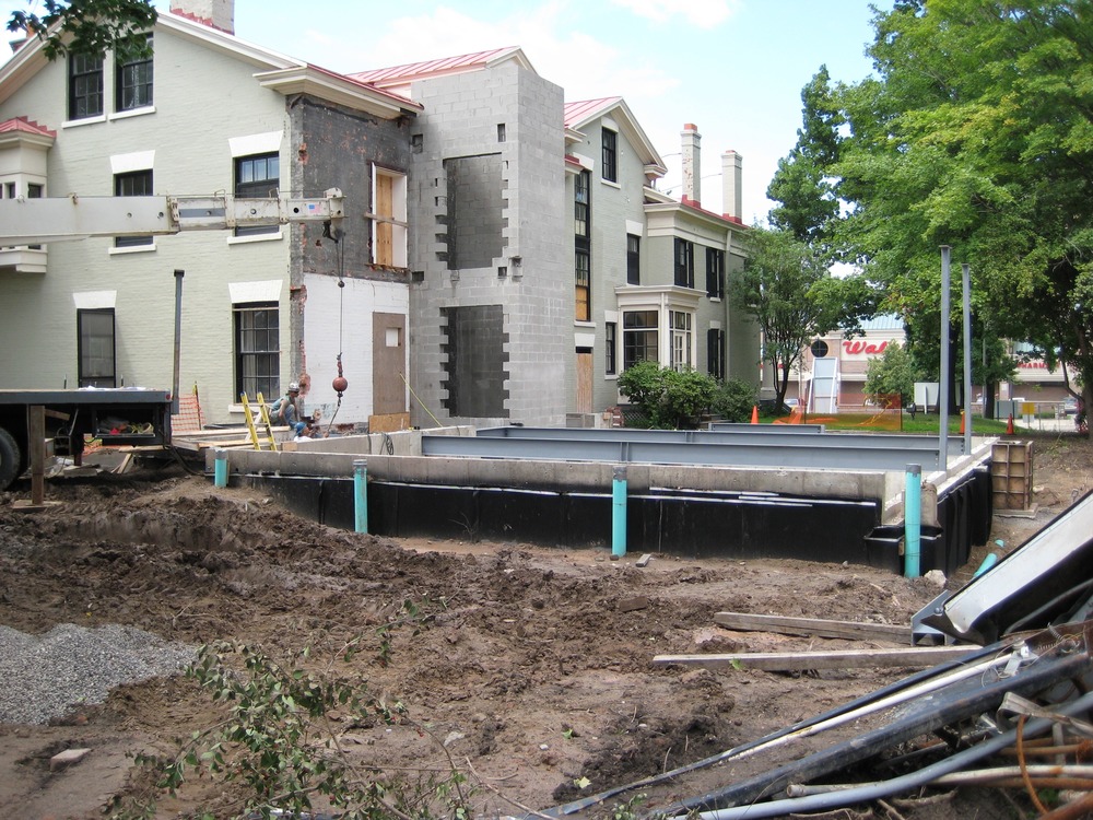 Progress indeed! These hefty steel I-beams will support the new structure's first floor. Now that things are beginning to move above ground, progress is more visible. Stop by and take a look (from behind the safety fence, of course). Al has been on vacation for a while. Won't he be surprised when he gets back!