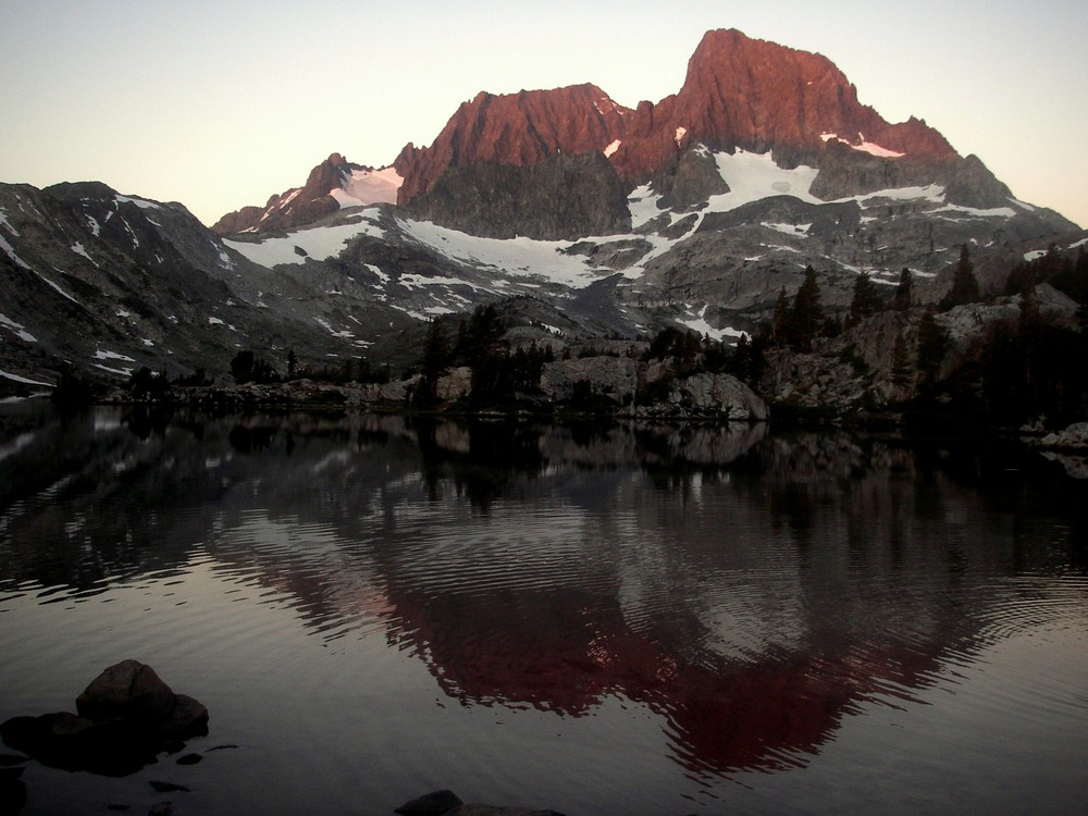 The sun creeps up on the Eastern Sierra at Garnet Lake, reached via the Agnew Meadows Trailhead.