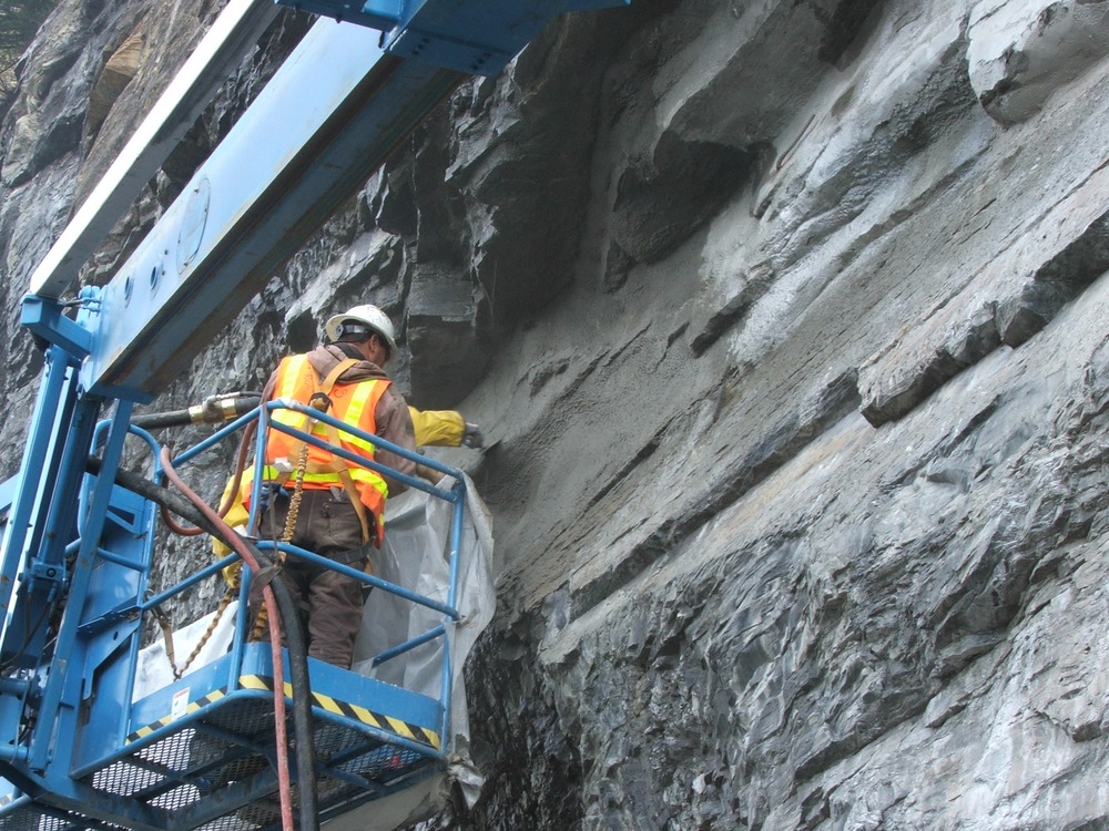 Construction crews performing shotcrete work