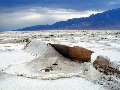 As salt crystals grow over time, slabs of the salt crust are uplifted and eroded.