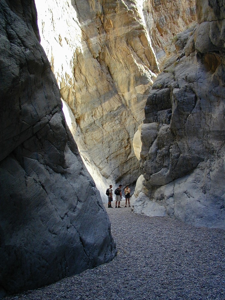 Hikers wanting to explore the narrows of Fall Canyon must climb around the dry-fall.