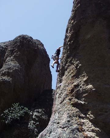 Todd Tempalski pulling past the first crux (2nd bolt). Adrenaline Junkies 5.10c * Proclamation Pinnacle, High Peaks West. Cinco de Mayo 02