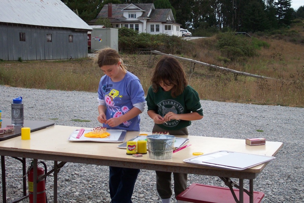 Fire Science: These visitors are setting up an experiment to investigate the effects of slope on fire behavior. Weather, topography, and fuel are the three main factors that determine how quickly and how intensely a fire will burn. This activity is from the Fireworks curriculum, developed by the U. S. Forest Service in Montana.