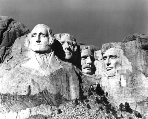 Black and white photo of a completed Mount Rushmore.