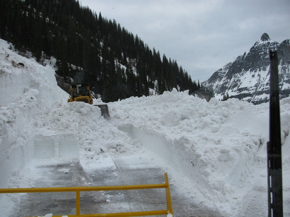 Dozer pushing snow to rotary plow at the Big Bend