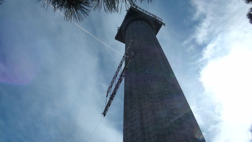 Second piece of truss for scaffolding is lifted into place.