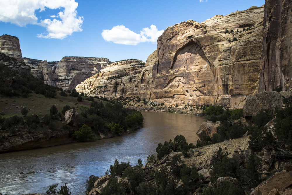 The Yampa River flows past cliffs in Outlaw Park.