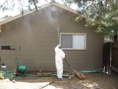 Worker Painting South Rim Residence