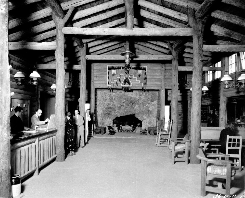 VIEW FROM THE FRONT ENTRANCE ENTRANCE PAST THE FRONT DESK (L) AND NORTH ACROSS THE LOBBY TO THE FIREPLACE. CIRCA 1936. SANTA FE RR PHOTO - 09684