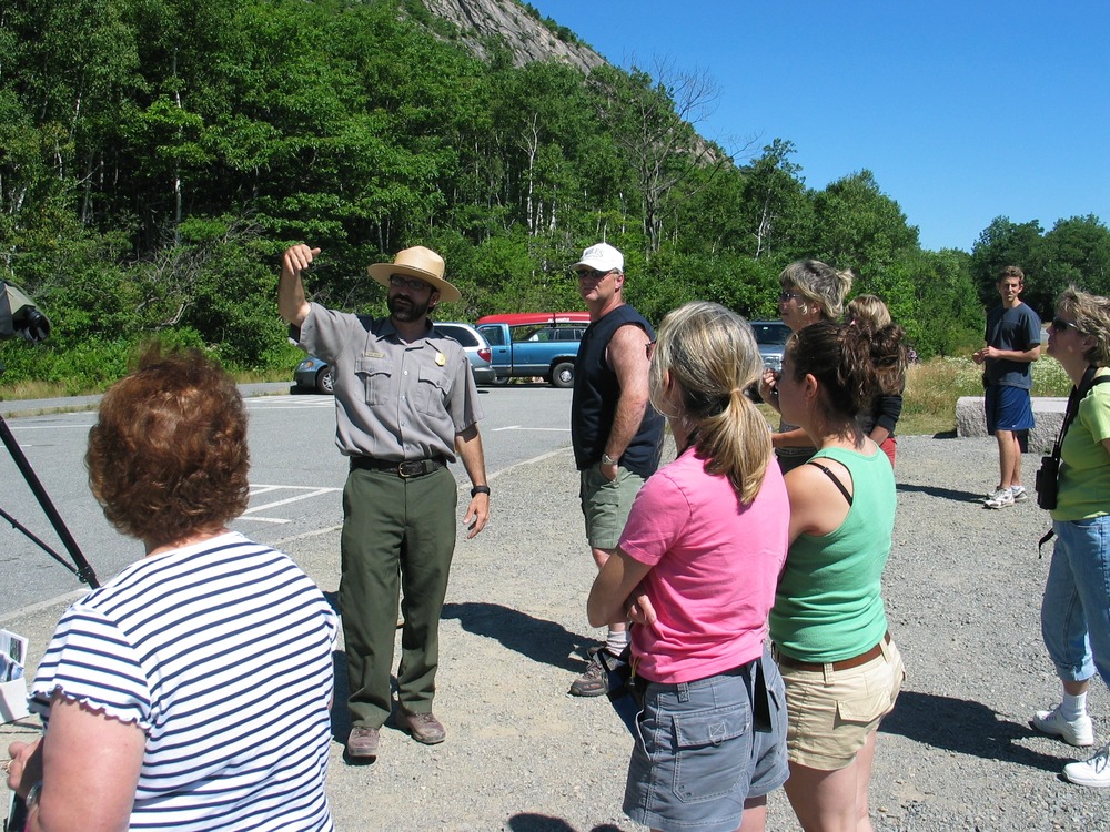 A ranger educates visitors about Peregrine Falcons.