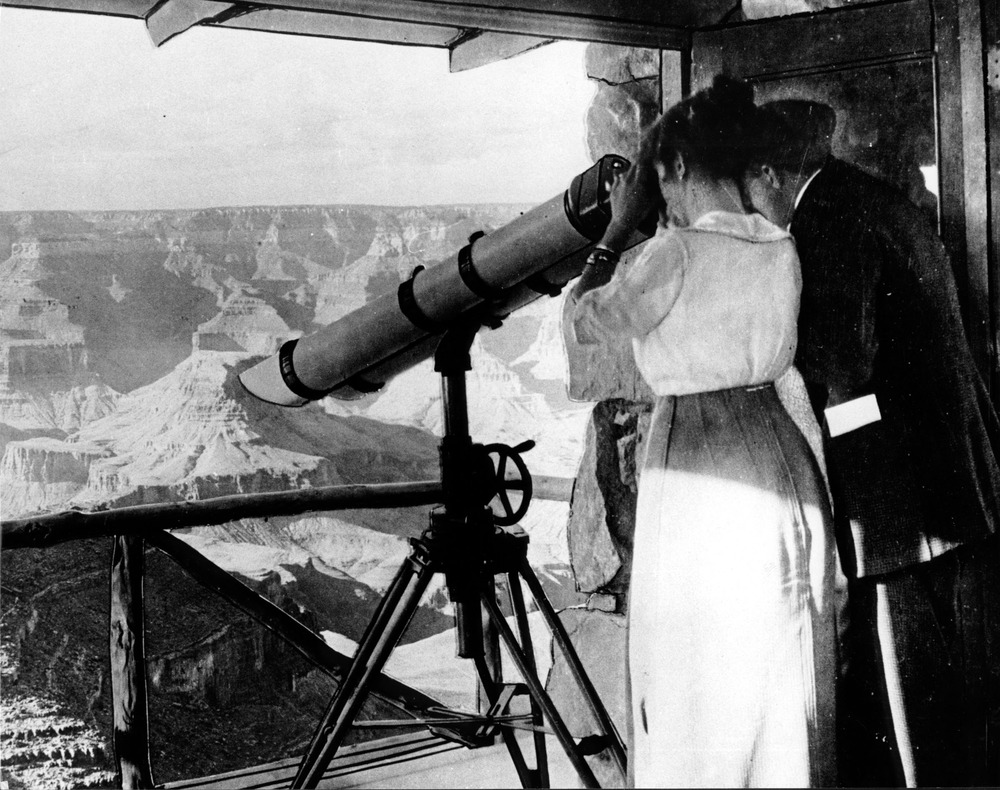 LOOKOUT STUDIO. "IN THE TELESCOPE TOWER" (CANYON IMAGE PASTED IN WINDOW) COUPLE VIEWING CANYON. GRCA 50633 CIRCA 1915. SANTA FE RR PHOTO.