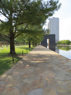 The pathway in front of the Field of Empty Chiars leads to the 9:03 Gate and the Regency Tower in the background