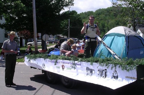 Supt. Northup with the lakeshore's entry in the Munising Fourth of July parade. It featured Bill & Birch and Bruce & Maddie, highlighting recreational opportunities at the park such as kayaking, fishing, camping, and birding.