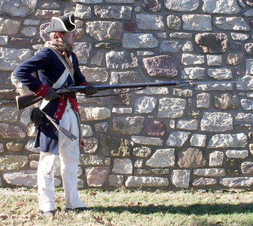 Charge Bayonet! Bring the butt of the firelock under the right arm, letting the piece fall strongly on the palm of the left hand, muzzle pointing directly to the front with the butt of the weapon pressed wth the arm against the side