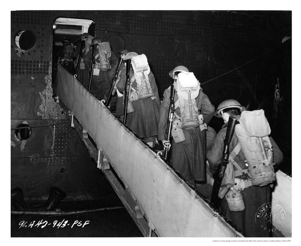 Troops at the Port of Embarkation loading a transport ship, cWWII. Most embarkations were done at night at the beginning of the war.
