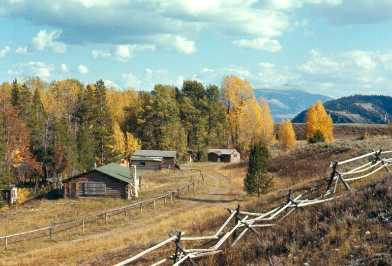 Half Moon Ranch in fall, cabins, buck and rail fence