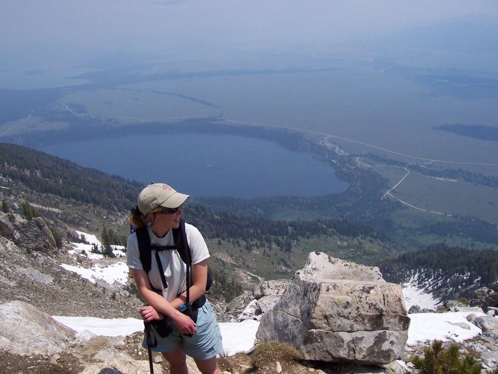 hiker on Apex Trail, Teewinot, valley below