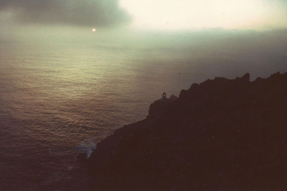 HPRC 003040 Lighthouse and cliffs at Sunset
