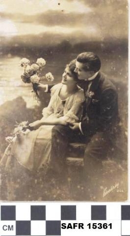 SAFR 15361: Postcard of formally dressed romantic couple with flowers at the shore, ca. 1900.