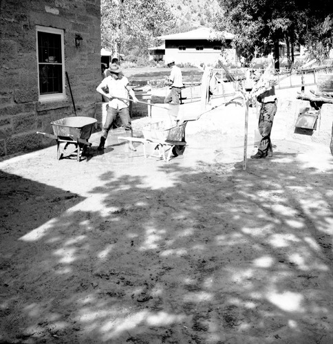 Cleanup of flood damage at ranger dorm. [One of two images on single strip of film. See also ZION 8578 frame 2.]