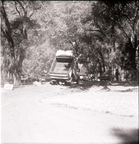 Tractor dumping construction materials for the Grotto parking area.