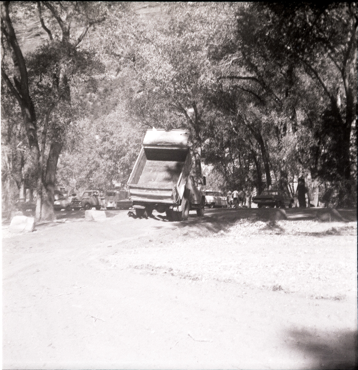 Tractor dumping construction materials for the Grotto parking area.