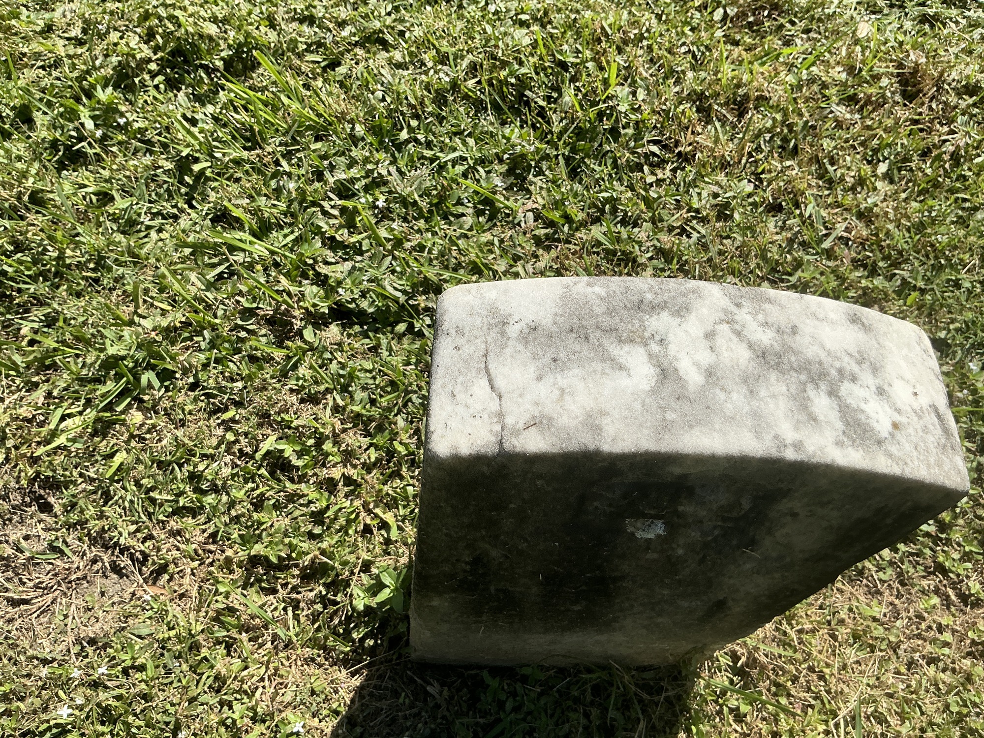 Extra image of historic upright marble headstone with recessed shield with recessed lettering face.