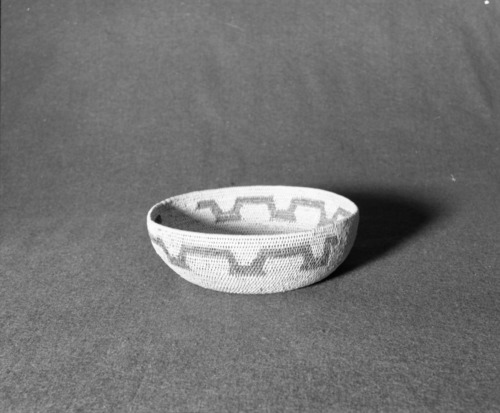 Marie Rozier Collection, Catalog No. 74. Object: Miwok basket. Dimensions: 8 1/2 x 3". Materials: split bull pine, fern root. Technology: fag ends trimmed on work face, moving ends trimmed on interior, overstitched clockspring start. Collection History: from Alice Reade collection (Bendorf). Photographed by Michael Dixon, December 1982. Catalogued by Craig Bates and Barbara Beroza. Yosemite Collections, National Park Service.