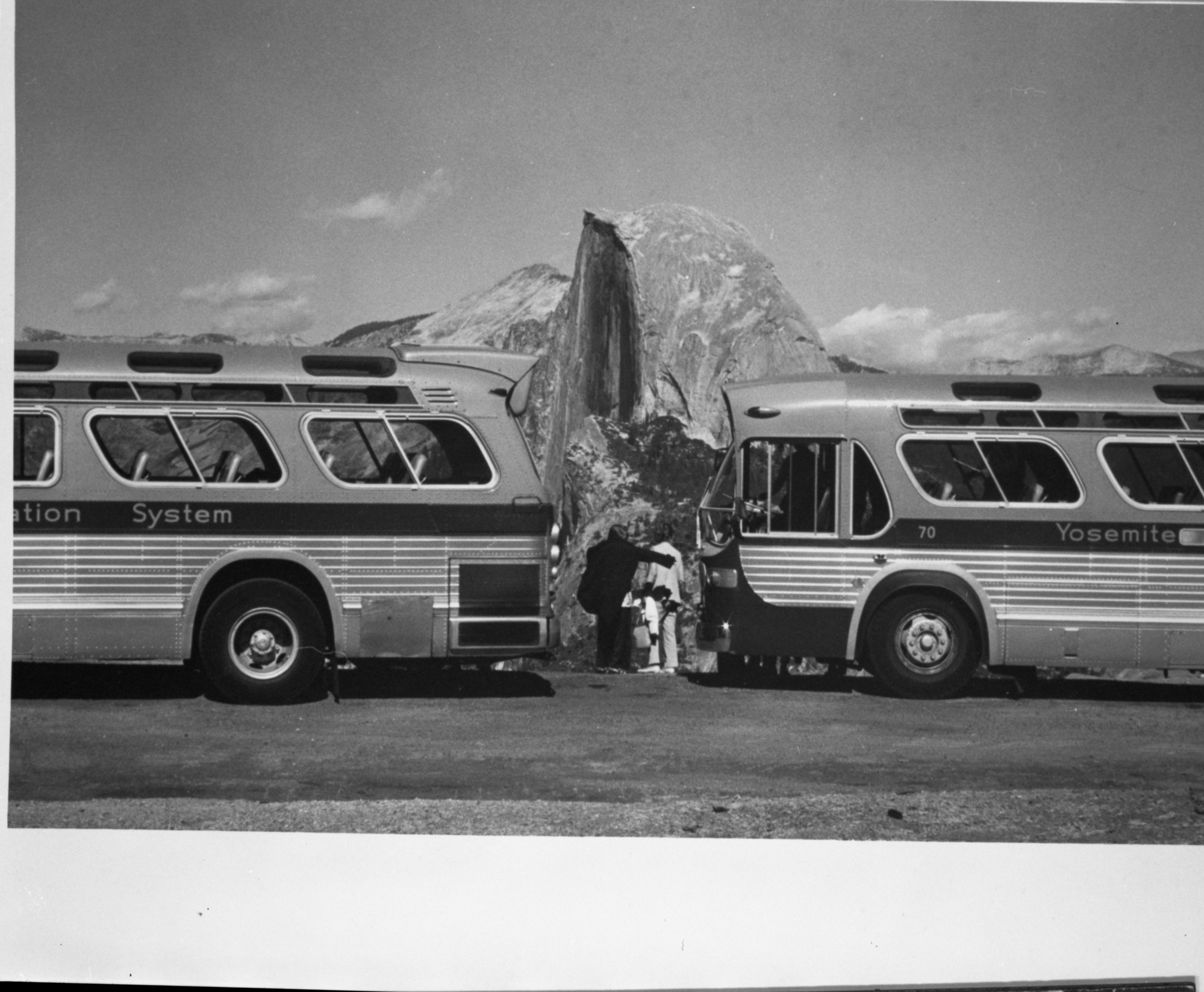 Two buses at Glacier Point with Half Dome in the background. copied by Leroy Radanovich