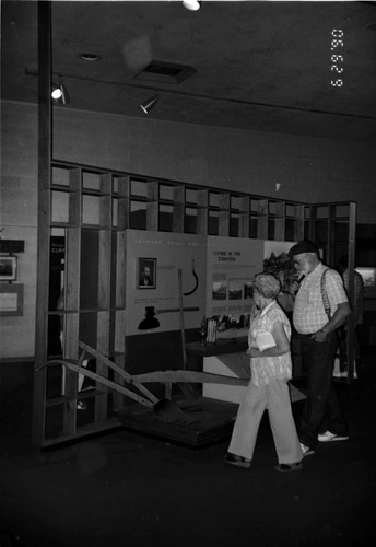 Visitors viewing the interpretive display in the old Mission 66 Visitor Center and Museum.
