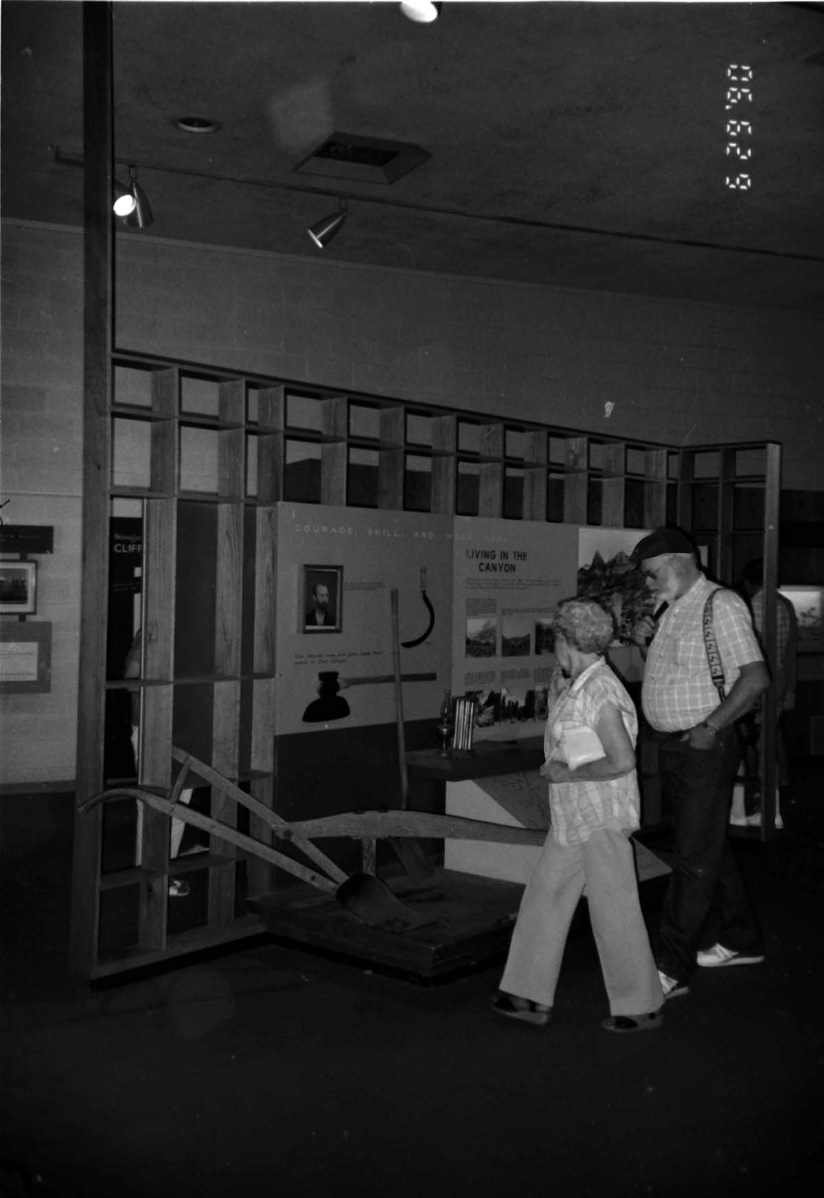 Visitors viewing the interpretive display in the old Mission 66 Visitor Center and Museum.