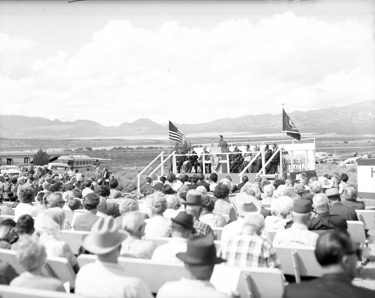 Warren F. Hamilton, Superintendent of Zion National Park, addressing visitors from podium at dedication of Taylor Creek road (Kolob Canyons).