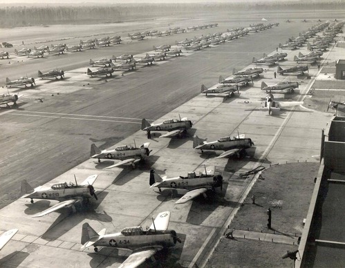 Black and white photo of lines of planes on a large field