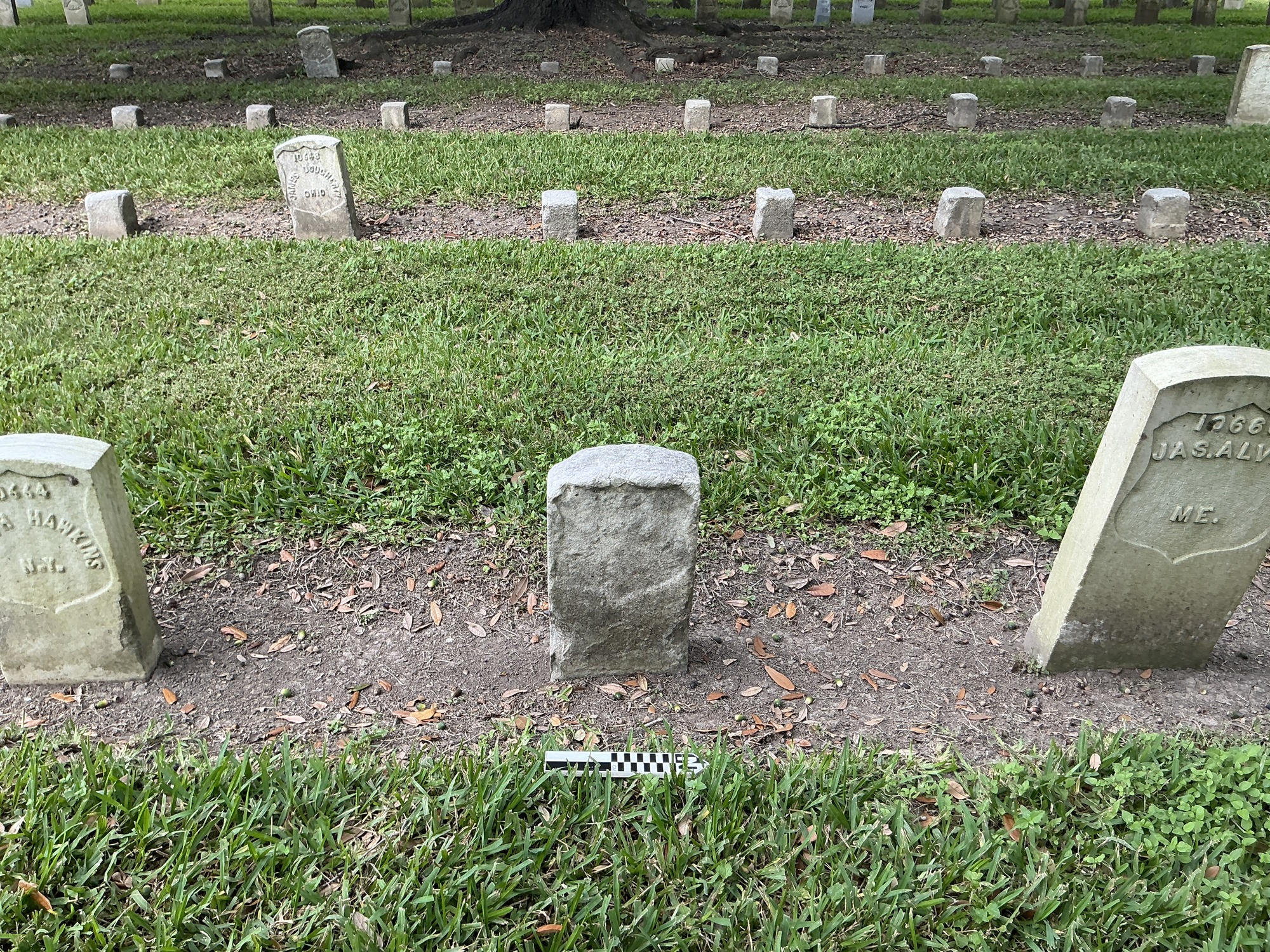 Extra image of historic upright marble headstone with recessed shield face.