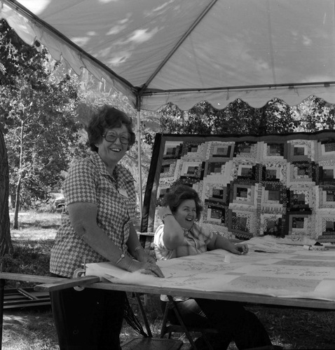 Vilo DeMille and daughter working on quilt at second annual Folklife Festival, Zion National Park Nature Center, September 1978. [No photo or positive. Fingerprints and smudges on the negative.]