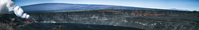 Panorama of Kīlauea erupting, and Maunaloa and Maunakea volcanoes in a distance. 