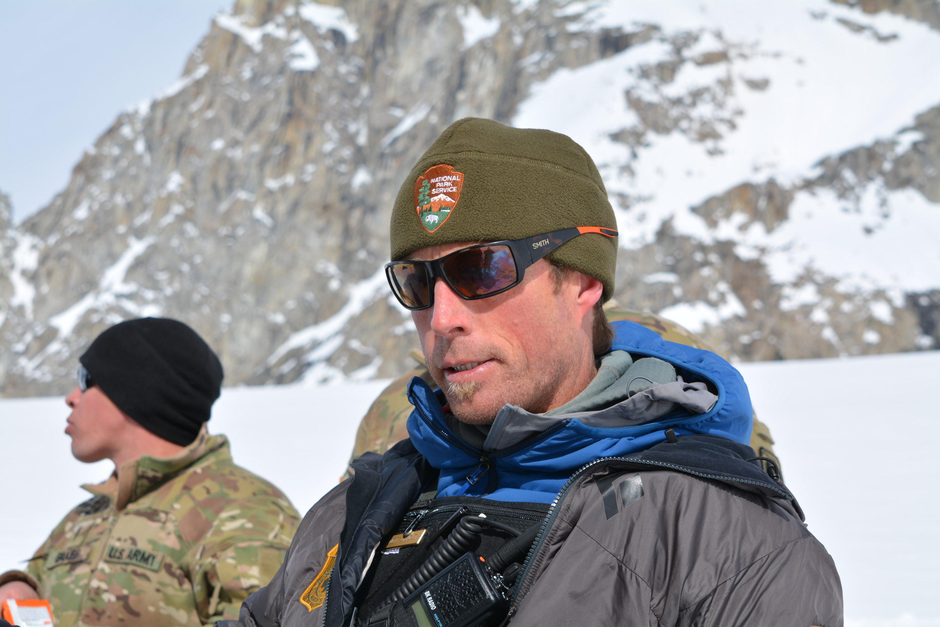 a park ranger and soldier on a glacier