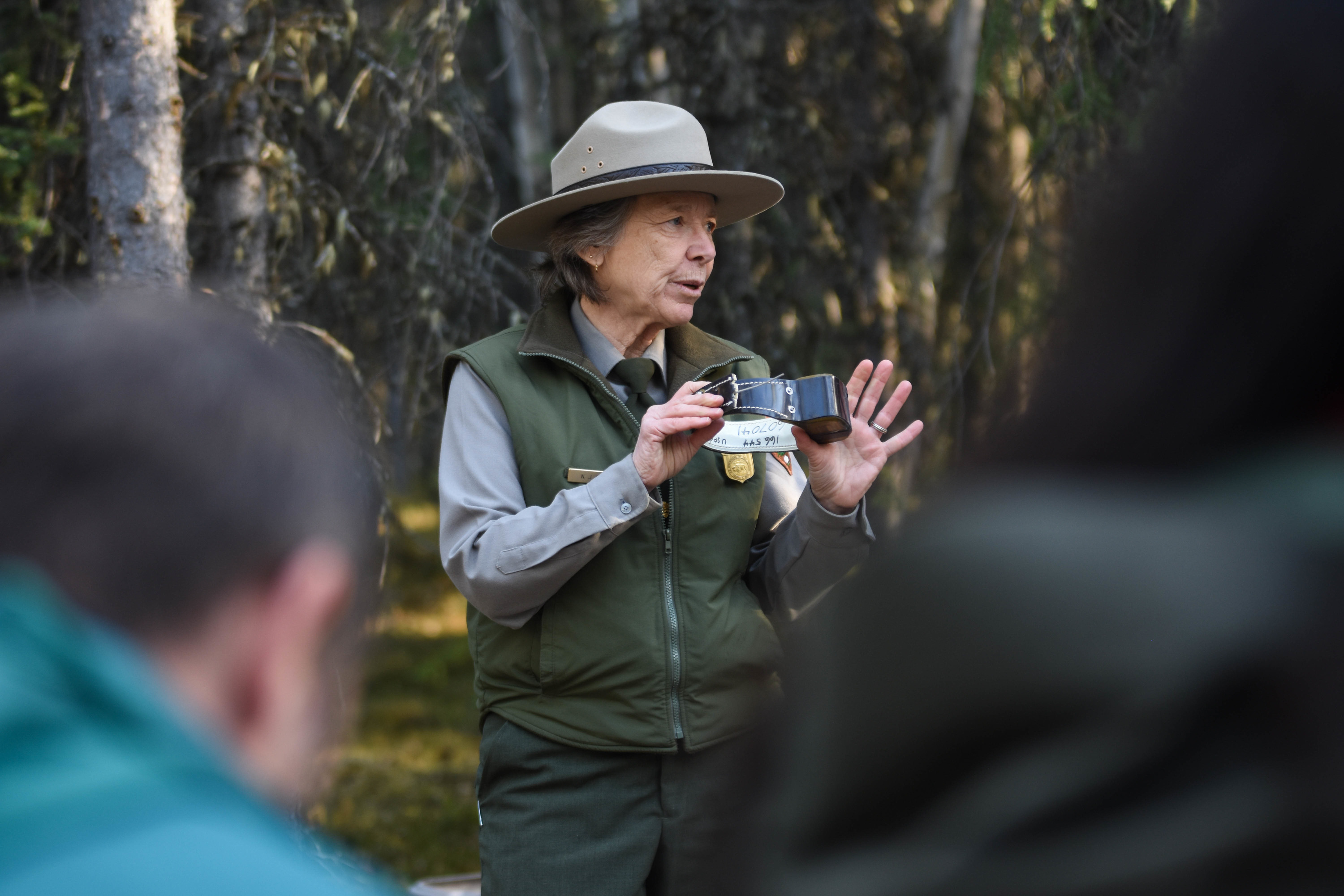 park ranger speaking to seated crowd