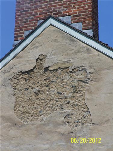 2012 - Views of the deteriorating stucco on the west elevation of the historic John Wilson Building #45 in Lower Town, Harpers Ferry, WV.