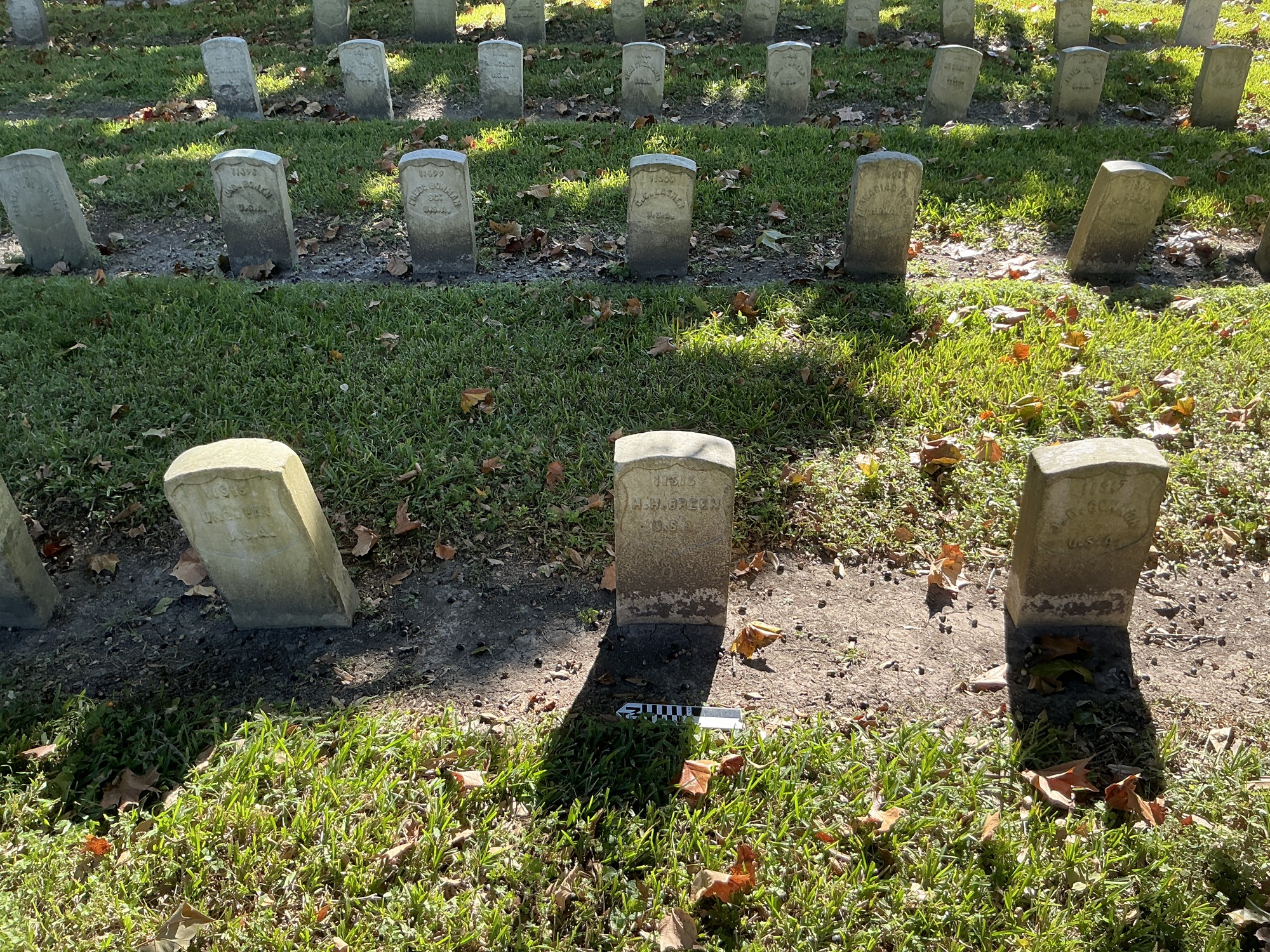 Extra image of historic upright marble headstone with recessed shield face.