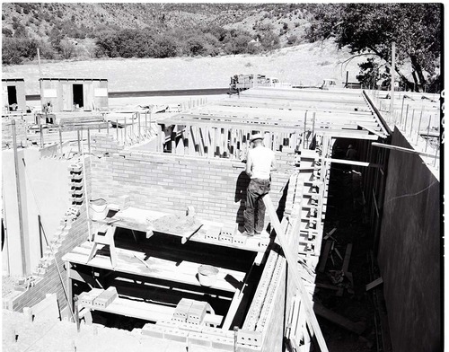 Laying brick of fireproof vault in basement of Mission 66 Visitor Center and Museum.